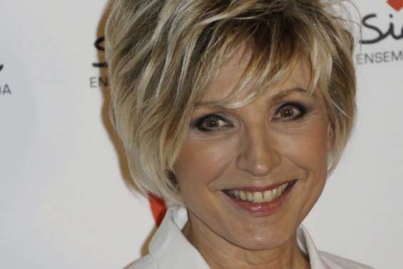 Sous une pluie d'infos, Evelyne Dhéliat regarde le climat s'emballer