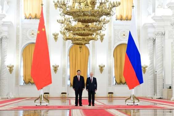Poutine et Xi célèbrent leur relation 
